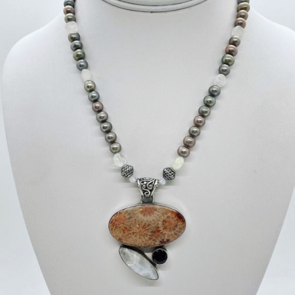 Moonstone garnet coral fossil pendant on a freshwater pearl moonstone necklace
